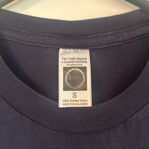 Uconn fair trade peace sign shirt